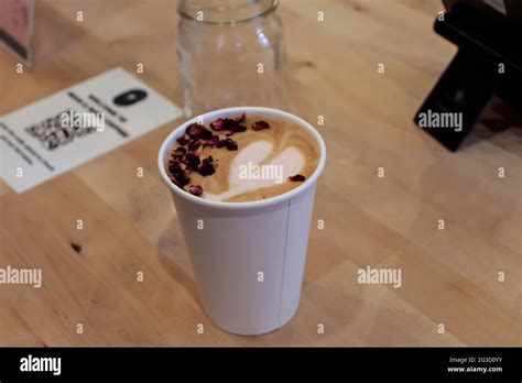 Rose latte with real rose petals inside. Latte art. Cafe, coffee shop ...
