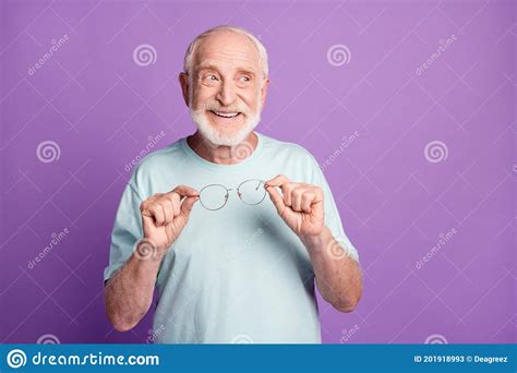 Photo Of Happy Old Man Looking Empty Space Hold Glasses Isolated Over