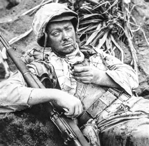 Cpl Rudolph E Engstrom Of Iowa Lies Wounded In A Shell Hole On Iwo