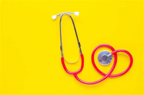 Premium Photo Stethoscope On Yellow Background Top View