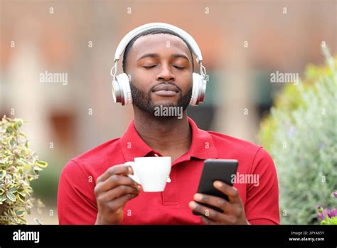 Black Man Relaxing Listening To Music Stock Photo Alamy