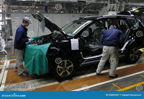 Workers Assemble A Car On Assembly Line In Car Factory Editorial