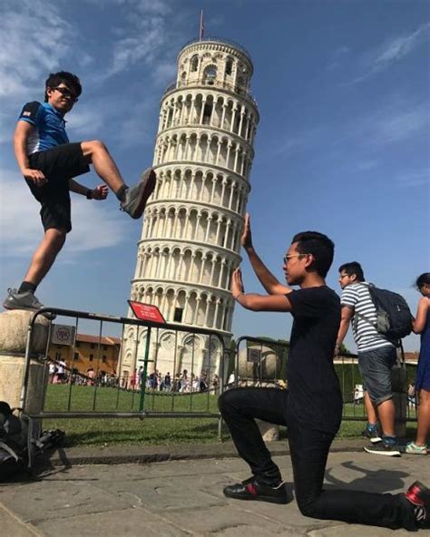 15 Brilliantly Original Photos Of People Posing With The Leaning Tower