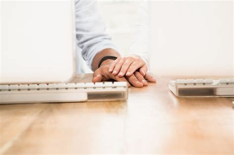 Premium Photo Two Casual Business Colleagues Putting Hands Together