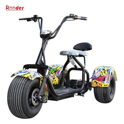 An Electric Scooter With Two Wheels And Graffiti On The Front Sitting