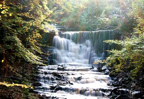 Beautiful Rainforest Waterfall With Fast Flowing Water And Rocks Long