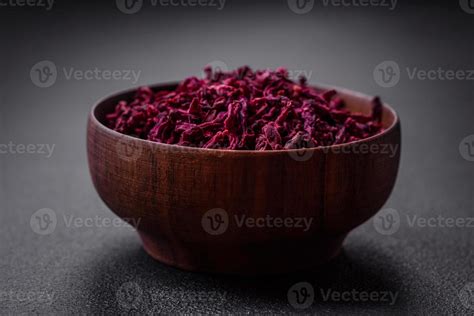 Dried Beets In Small Slices In A Wooden Bowl On A Black Concrete