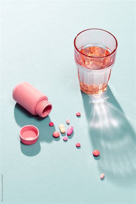 Supplement Or Medicine Bottle Pills And Water Glass By Stocksy Contributor Marc Tran Stocksy