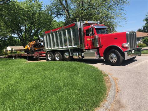 Our Top Of The Line Trucks For Your Professional Driveway Paving