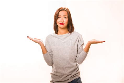 Brown Hair Beautiful Helpless Woman Wearing Grey Shirt And Jeans Stock