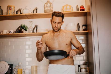 Chef With Naked Body Cooking In The Home Kitchen Stock Photo Image