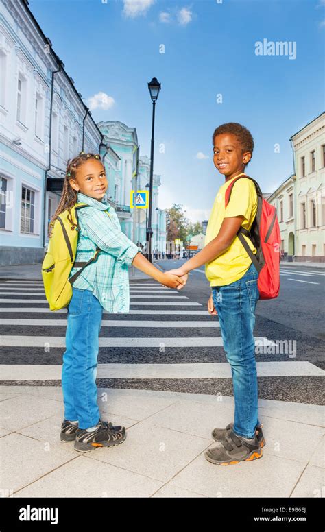 Two African Kids Hold Hands Stand Near Crossroad Stock Photo Alamy