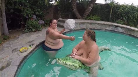 BBW Monika Mynx And Lola Smoking Is In The Pool And Lola Is On A Inflatable Alligator Monika