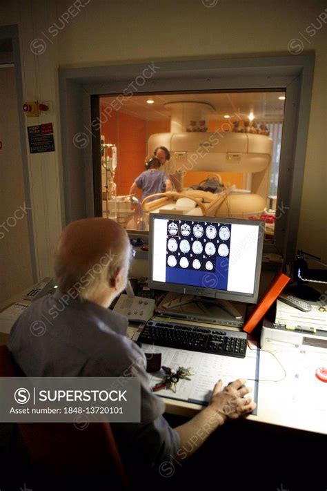 Doctor Monitoring Computer Radiographs Of Mri Machine Radiology