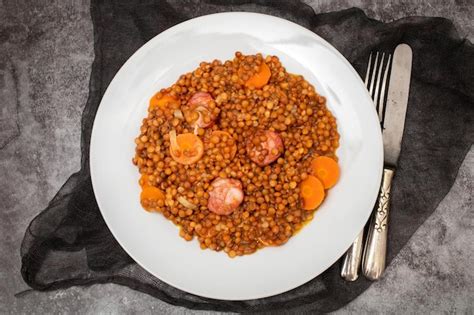 Premium Photo Lentils With Chorizo And Carrot On White Dish Typical