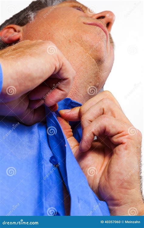 Young Man Buttoning Up His Shirt Stock Photo Image Of Face Dressing