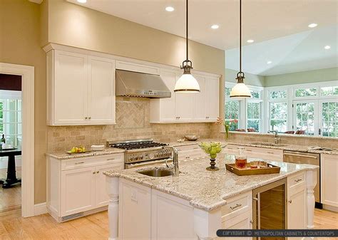 Beige Kitchen with Travertine Backsplash