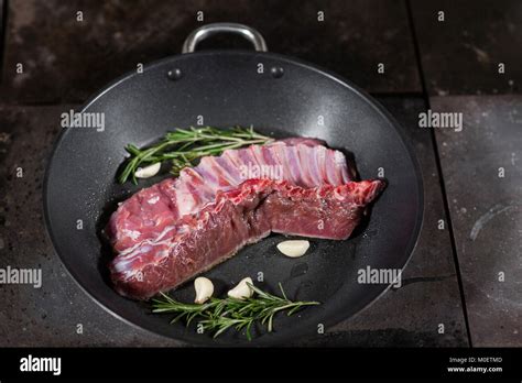 Fried Ribs Of Lamb Add A Sprig Of Rosemary And Garlic Cooking With Fire In Frying Pan