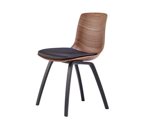 An Image Of A Wooden Chair With Black Leather Seat Pad On The Back And Legs