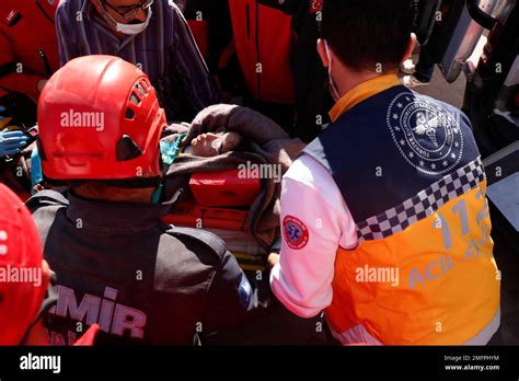 Medics And Rescue Personnel Carry Into An Ambulance An Injured Person