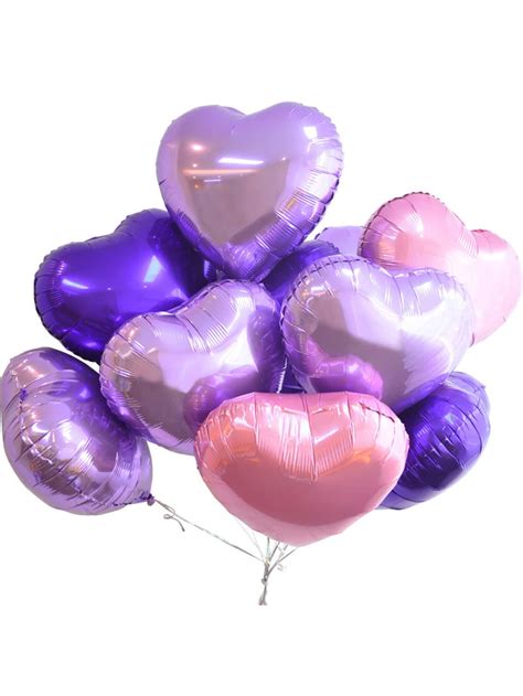 A Bunch Of Heart Shaped Balloons On A Stick