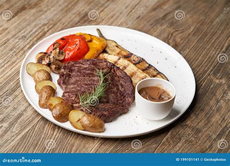 Ribeye Steak With Fried Potatoes Baked Vegetables With Beef Steak On