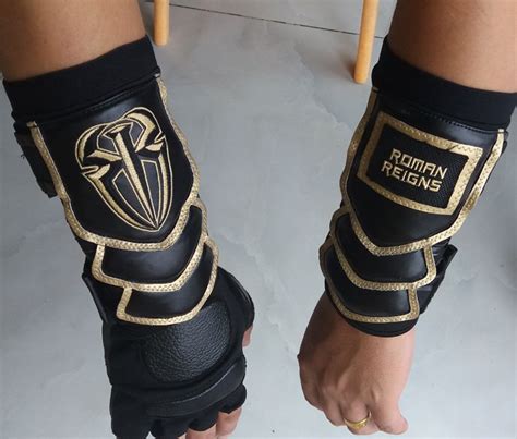 RAW American Wrestling Bracers Roman Reigns Used of a Game Gold Gloves ...