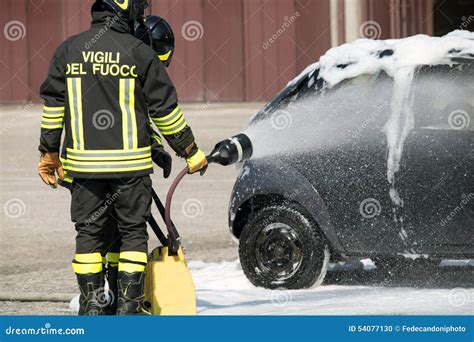 Firefighter in Action with Foam To Put Out the Fire Stock Photo - Image ...