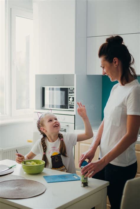 Mom With Her Daughter Are Cooking In The Kitchen Lifestyle Photo