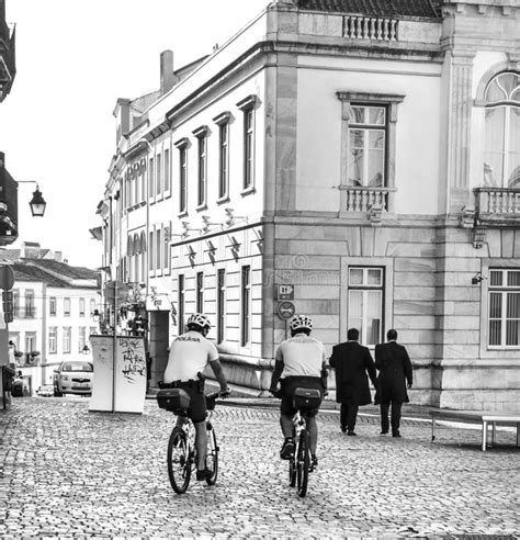 Typical Portuguese Facades And Narrow Cobblestone Streets In Evora