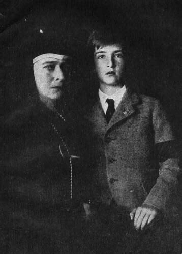 An Old Black And White Photo Of Two People