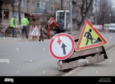 Road Signs Detour Road Repair On Street Background Truck And