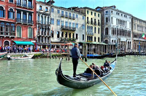 Gondola Rowing On Grand Canal In Venice Italy Encircle Photos