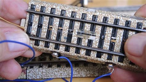 Someone Is Working On Some Kind Of Device That Looks Like A Train Track