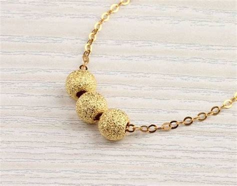 15 Ideas of Gold Ball Pendants