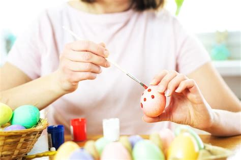 Premium Photo Close Up Of Female Hands Holding Pink Easter Egg And