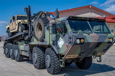 retrowar — An M1075 palletized load system truck carries an...