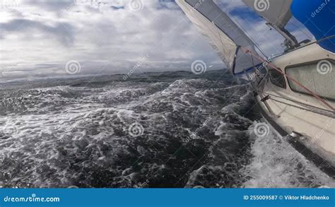 Sailboat Hull Cutting Through Water Bending On The Side Through Stormy