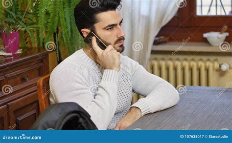 Handsome Young Man Talking On Telephone At Home Stock Image Image Of