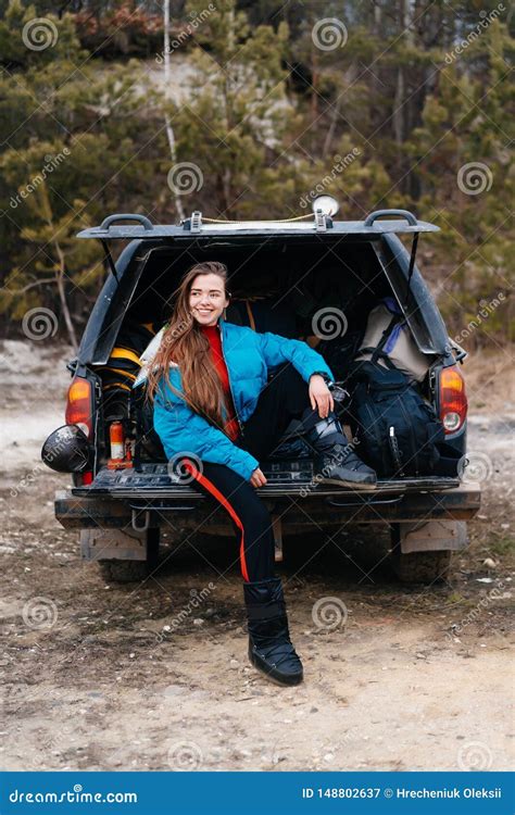 Young Woman Enjoying Nature While Sitting In The Car Trunk Stock Image