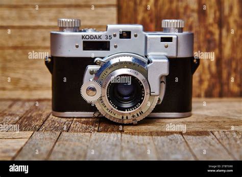 Vintage Kodak 35 Film Camera On Rustic Wooden Background Eye Level