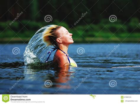 Beauty Model Girl Splashing Water With Her Hair Beautiful Woman In