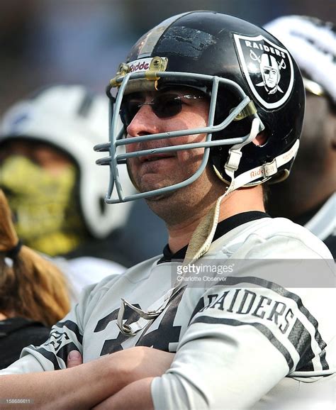 A Raiders Fan Watches Oakland Play The Carolina Panthers During