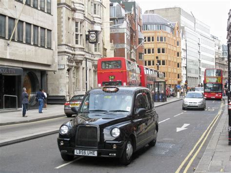 Taxi and Red Bus in London editorial photo. Image of europe - 15504541