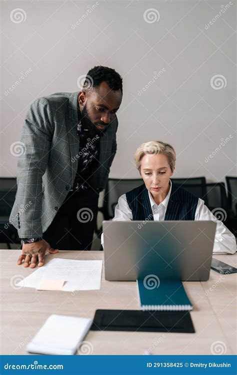 Vertical Portrait Of Diverse Business Partners Discussing Online