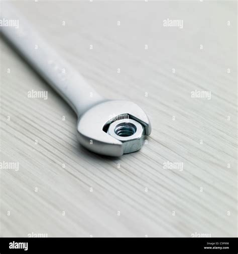 A wrench and a nut Stock Photo - Alamy