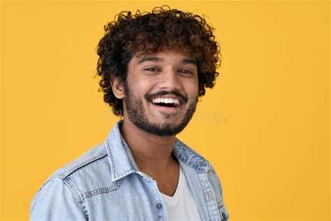 Happy Young Indian Guy Laughing Isolated On Yellow Background Headshot