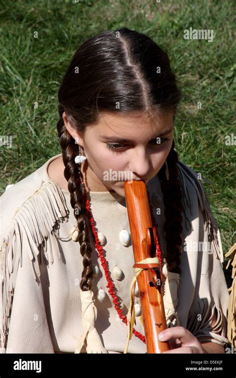 Native American Indian Girl Playing A Wooden Flute Stock Photo Royalty