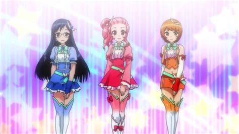 Three Anime Girls In Short Skirts Standing Next To Each Other