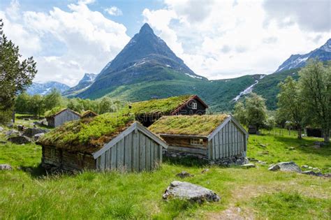 Verdant Rooftops Beneath Norways Majestic Peaks Innerdalen Valley